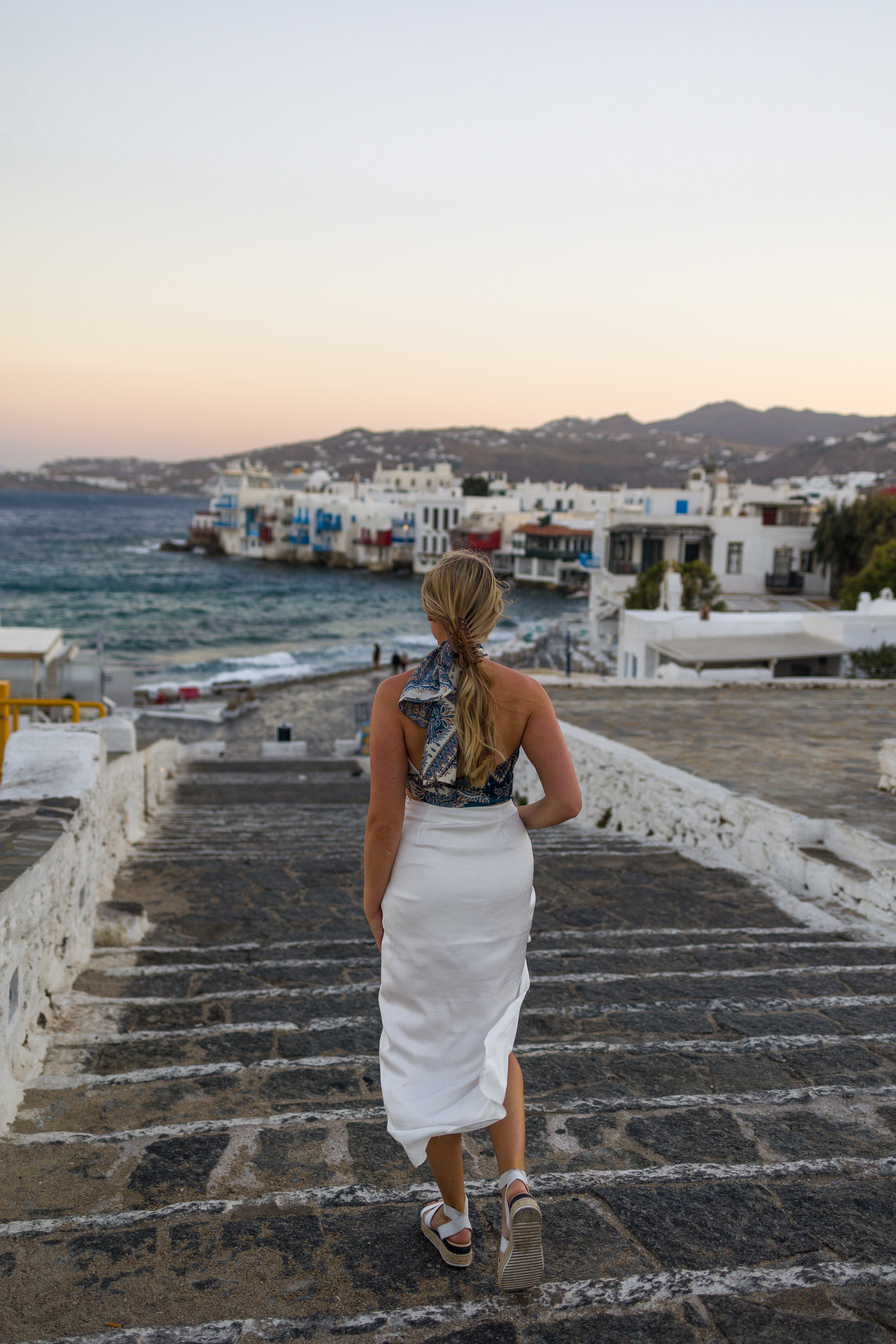 Blonde woman wearing white skirt